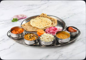 Wholesome Meal Box (2 Veggies+ 1 dal+ 1 rice dish+ 2 chapati+ 1 sweet+ papad & salad)