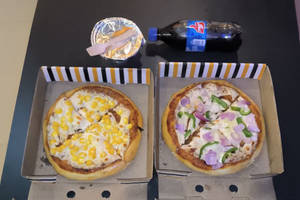 Yellow corn pizza+onion&capsicum pizza+ chaco lava +soft drinks