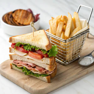 Giant Club Sandwich With House Fries Veg