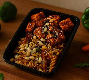 Grilled Cottage Cheese Pasta Garnished With Peanuts And Sesame Seeds