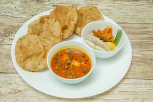 4 poori with sabji and salad                           