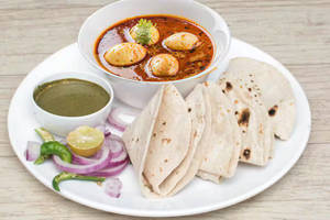 Egg curry With Tawa Roti 2Pcs         