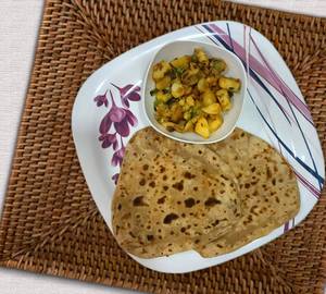 Jeera Aloo + 3 Butter Tawa Roti Or 2 Tawa Plain Parantha
