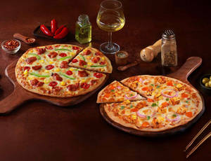 2 Regular Pizzas @ 169 each [Eligible for added...