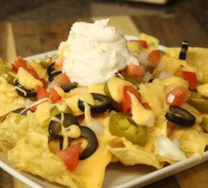 Nachos With Sour Cream In Cheese Sauce 
