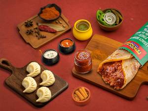 Schezwan Veg Frankie Roll + Choice Of Steamed Momos (4 Pcs)