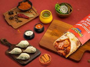 Chicken Tikka Frankie Roll+chicken Steamed Momos (4 Pcs)