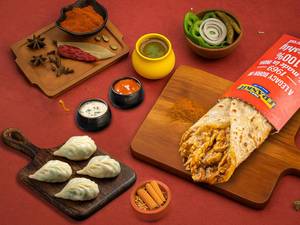 Classic Chicken Frankie Roll. + Chicken Steamed Momos (4 Pcs)