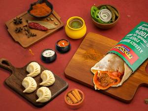 Veg Peri-peri Frankie Roll + Choice Of Steamed Momos (4 Pcs)
