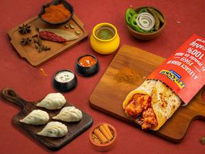 Schezwan Chicken Frankie Roll+chicken Steamed Momos (4 Pcs)