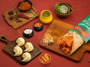 Schezwan Paneer Frankie Roll + Choice Of Steamed Momos (4 Pcs)