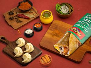 Tawa Soya Chap Frankie Roll + Choice Of Steamed Momos (4 Pcs)