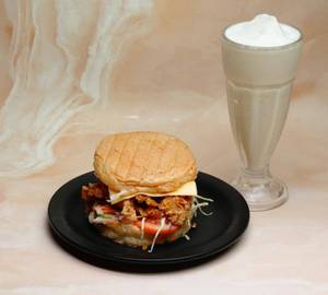 Cheesy Chicken Zinger Burger With Malabar Karikkin  Shake.