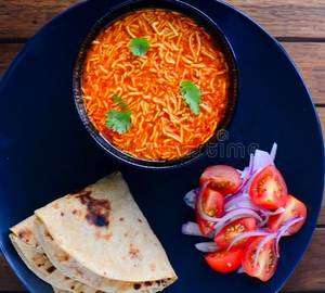 Sev Tamatar/ Roti B(4)/Papad/Salad