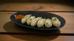 Chicken steamed momos [6 pieces]