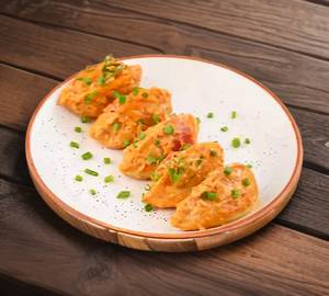 Cheese Fried Momo In Molten Cheesy Sauce (6 Pieces)