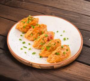 Cheese Fried Momo In Molten Cheesy Sauce [6 Pieces]