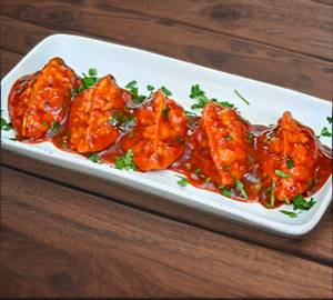 Cheese Pan Fried Momos In Tomato Garlic Sauce [6 Pieces]