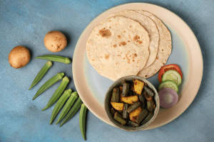 1 bhindi ka sabji  and  1 aloo ka paratha and sabji