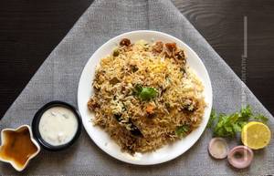 Chicken biryani full + raita + salad + cold beverage [250 ml]