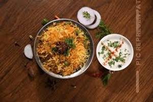 Veg biryani with raita and salad                                           