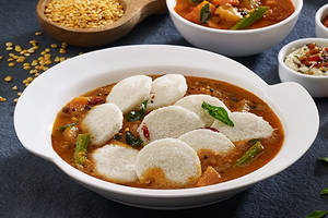 Mini Idlis dipped in sambhar (12 Pcs)