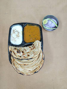 Dal Makhani + Choice Of Bread + Masala Dahi + Salad
