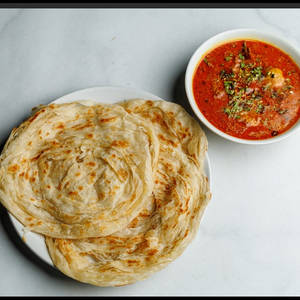 2 Kerala Porota+ 2 Piece Chicken Curry