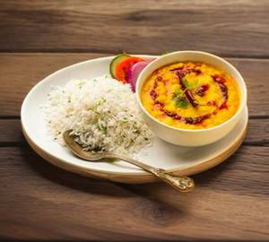 Daal tadka, plain rice, salad, green chatni