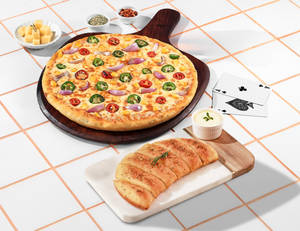 Fiery Veg Pizza [Big 10"] + Garlic Bread & Chee...