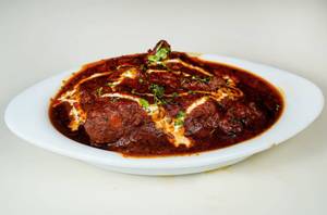 Mutton tikka with gravy