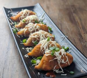 Cheese Topped & Tossed Chicken Momo