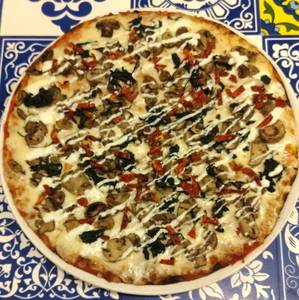 Mushrooms, Sundried Tomatoes, Wilted Spinach, Goat Cheese