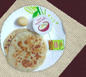 Paneer paratha (2 pieces) with dahi, pickle sweet & campa.