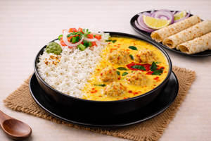 Punjabi Style Kadhi Rice (650 Ml) + Papad & Salad