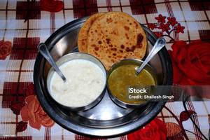 Aloo paratha 2 pieces + kheer + sabji + salad