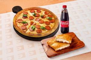 Medium Non-Veg Pizza + Garlic Bread + Bevarage at 449