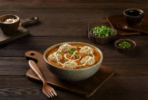 Veg Momos In Makhni Gravy