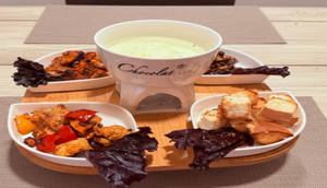 A Swiss Speciality-swiss Cheese Fondue With Traditional Accompaniments (chicken Based)