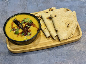 4 Tawa Atta Rotis + Yellow Dal (300ml)