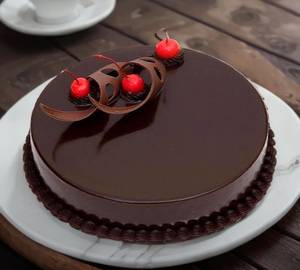 Special dark chocolate cake [full] with candle