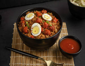 Boiled Egg Schezwan Chicken Fried Rice