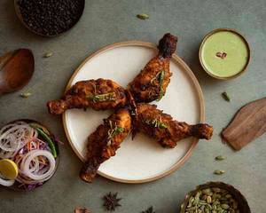 Achari Murgh Kalmi Tangdi