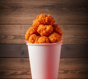 Crispy And Spicy Bite Sized Chicken Pieces Coated With Flavorful Spices And Golden Perfection.