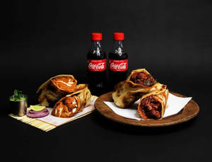 Chaap Butter Masala Roll + Chilli Paneer Roll + 2 Coke (250 Ml)