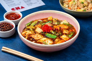 Exotic Vegetables And Cottage Cheese In Schezwan Sauce Gravy
