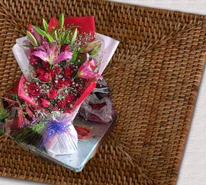 Red rose with lilies