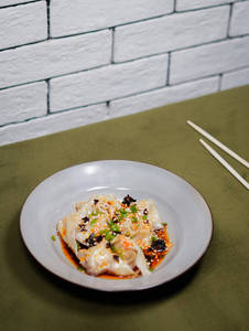 Veg Steam Wonton Topped With Spicy Chilly Malagaze Sauce