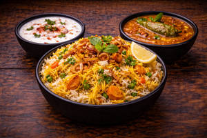 Veg Dum Biryani Small +raita+salan