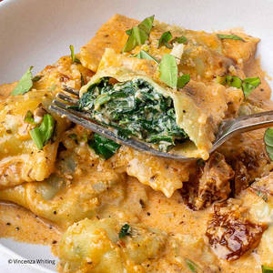 Spinach And Ricotta Cheese Ravioli In Basil Infused Pomodoro Sauce